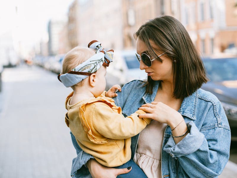 Mother comforting sleeping baby